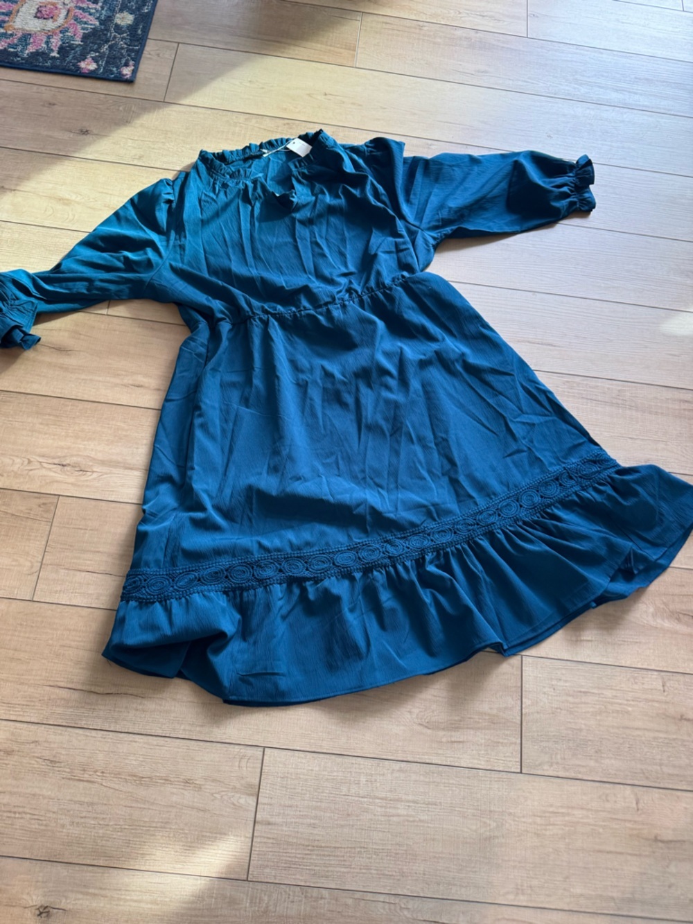 BloomChic Teal Blue NWT dress. Cute neckline and details at hem of dress.